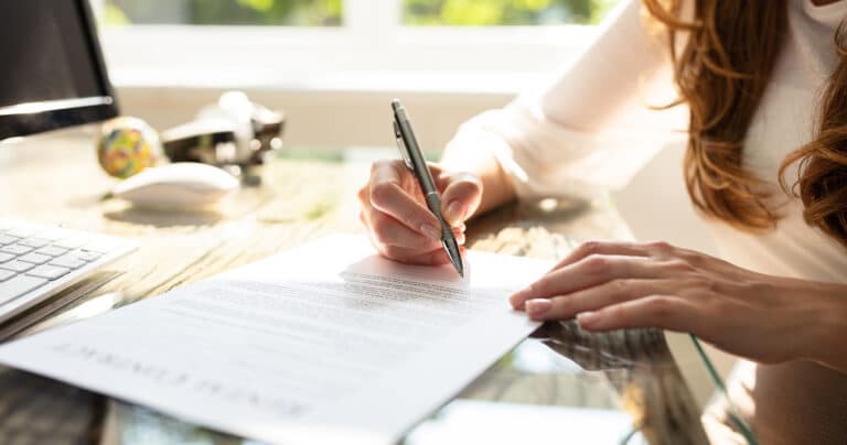 Woman hand writing contract
