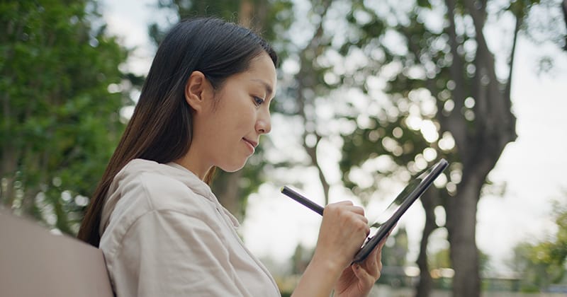 Woman working on landscape design on tablet